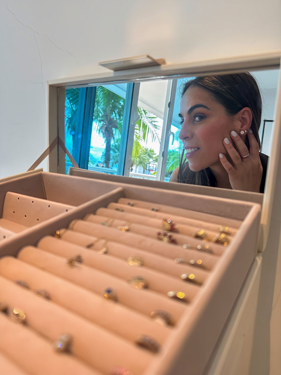 Patricia picking pieces from her jewelry box